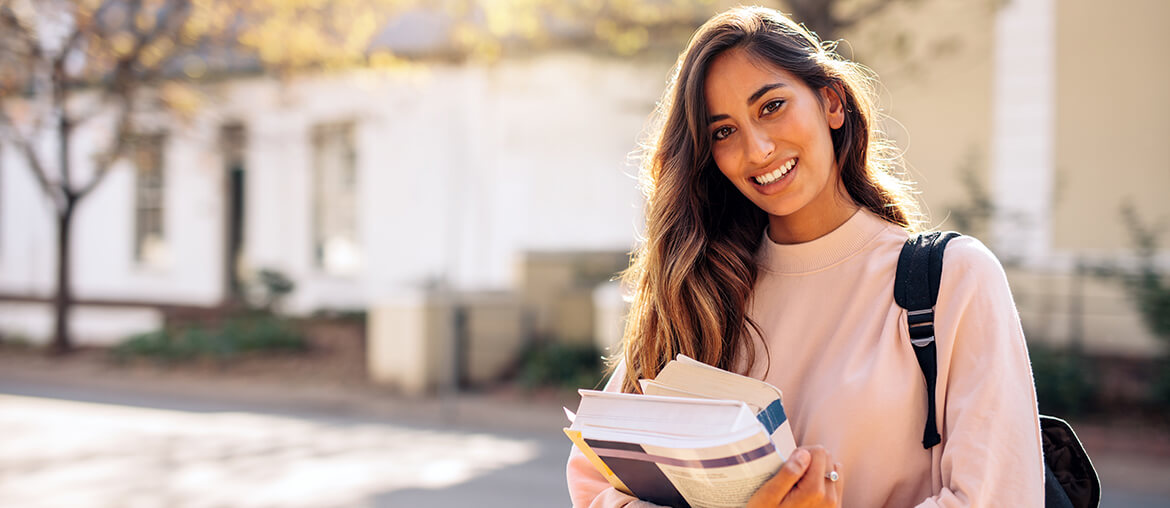student carrying books